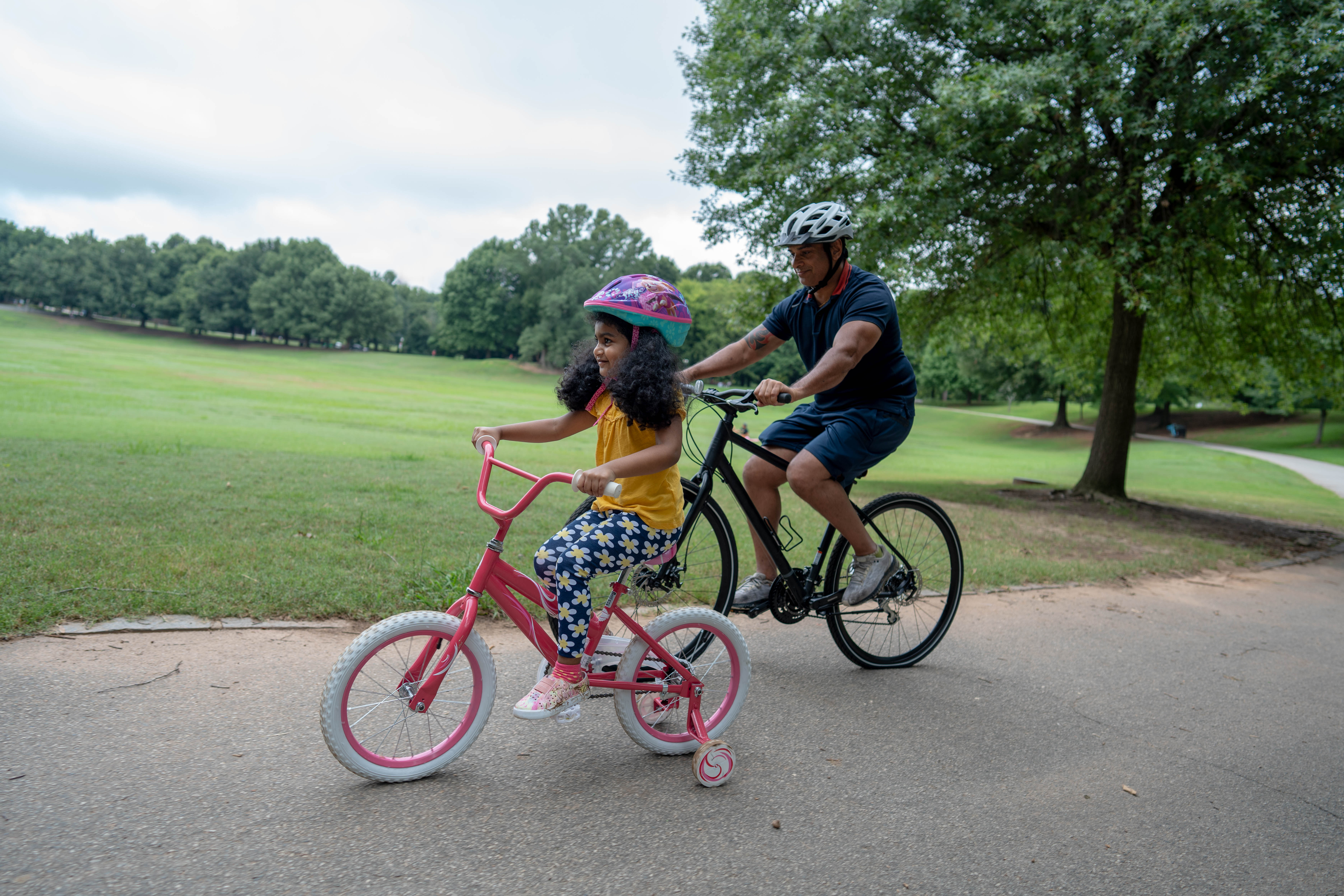 More Details about Child Riding Bike Along Parent - 2