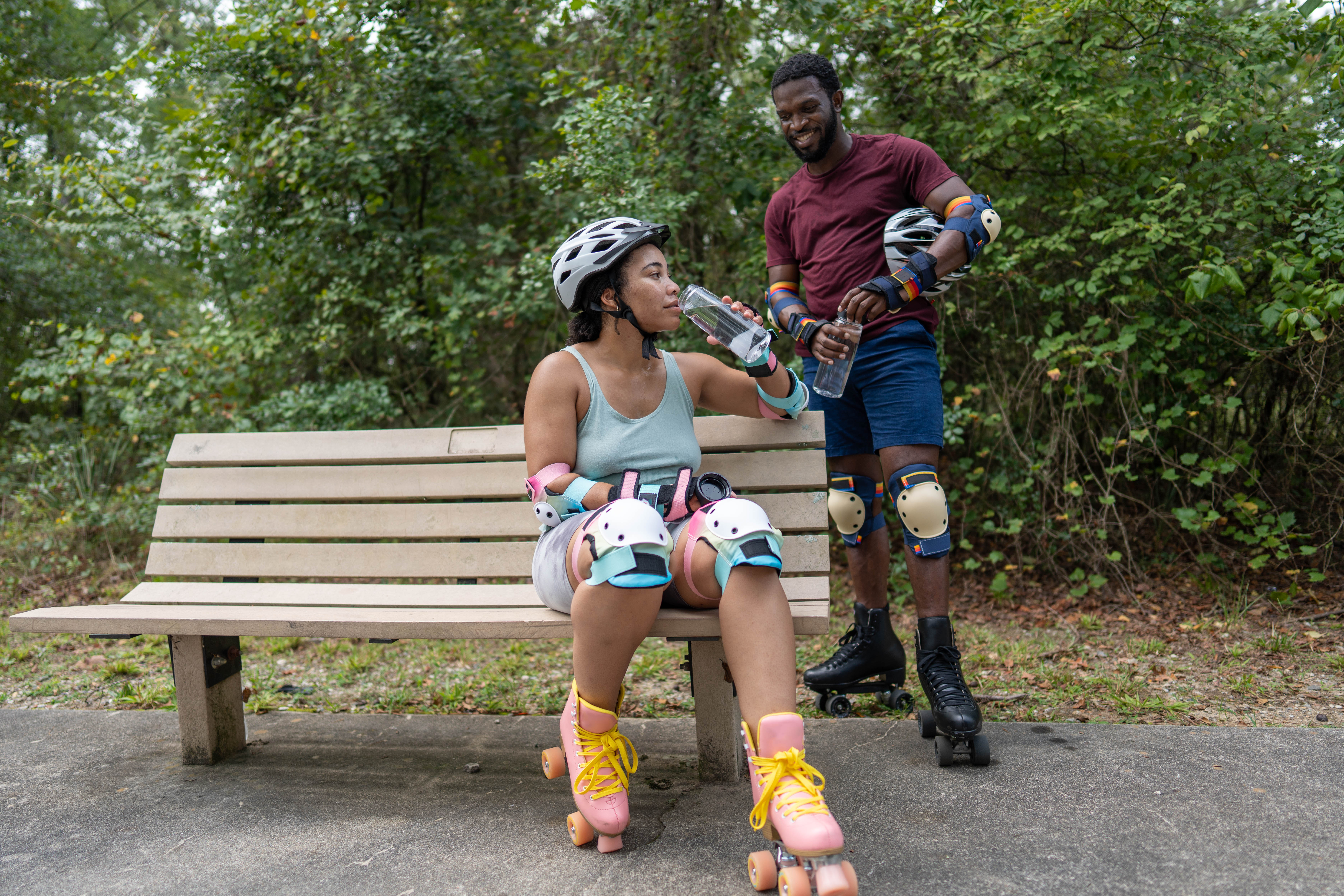 More Details about Couple in Rollerblades Drinking Water