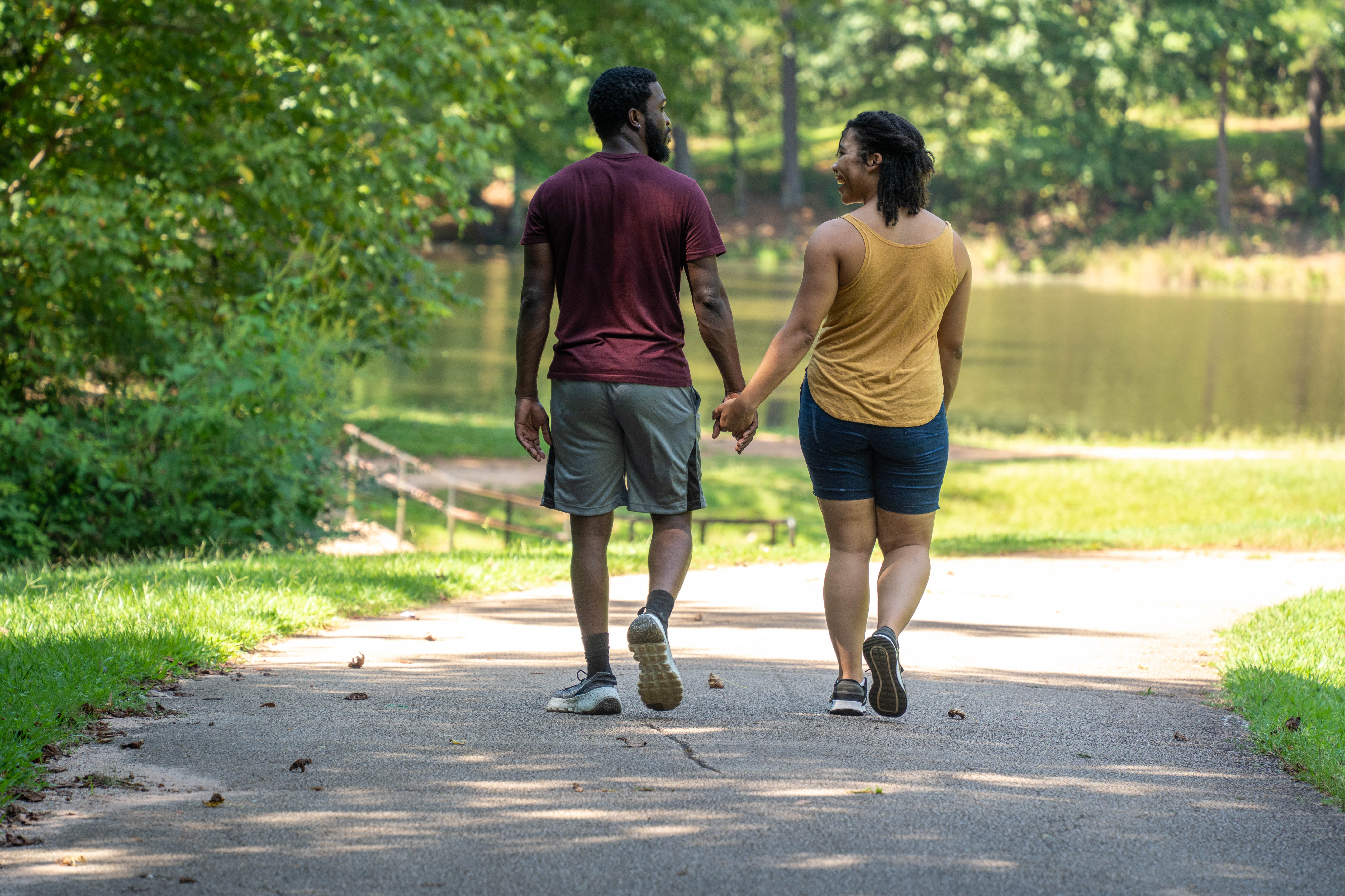 More Details about Couple Holding Hands While Walking