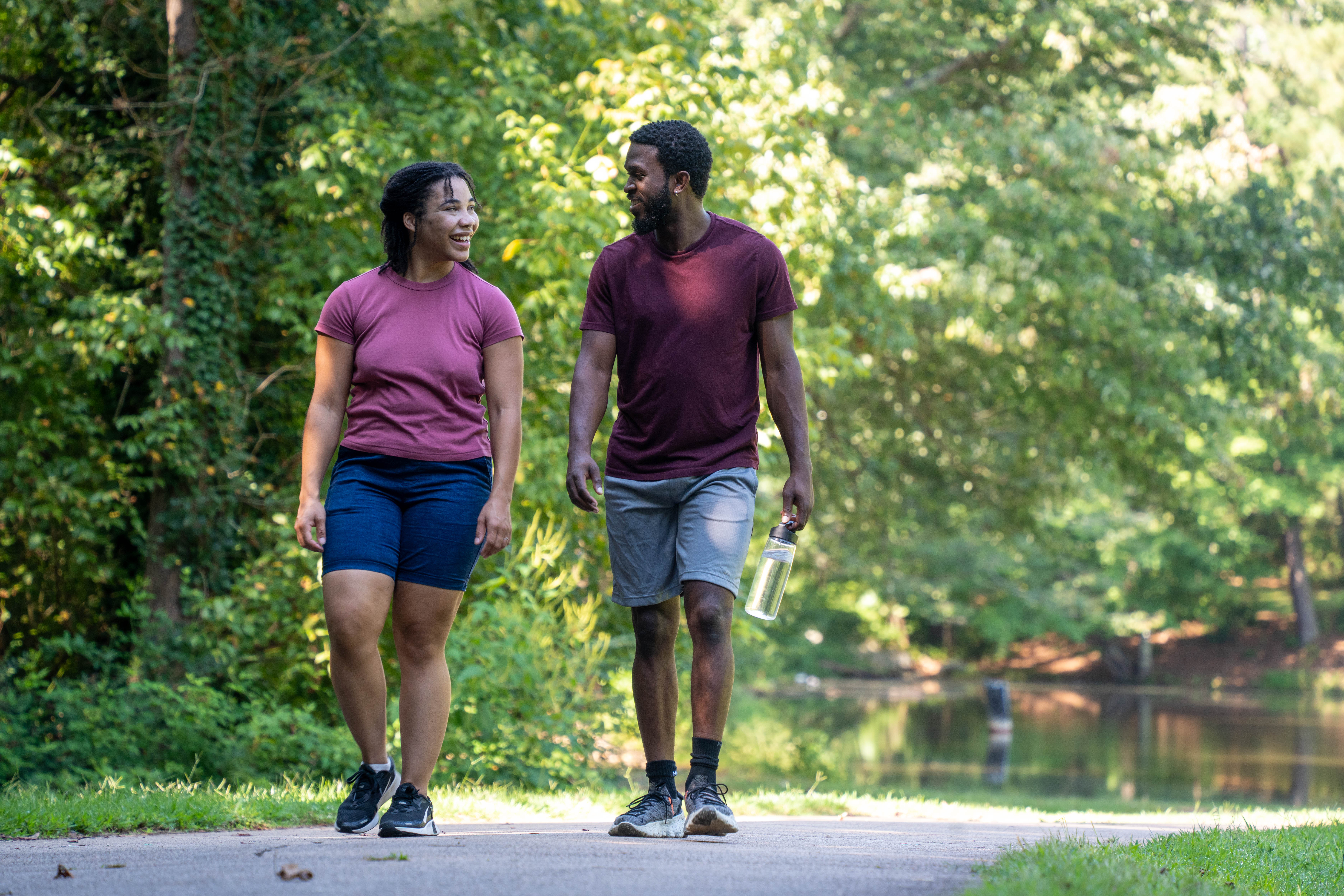 More Details about Couple Walking Near Pond - 2