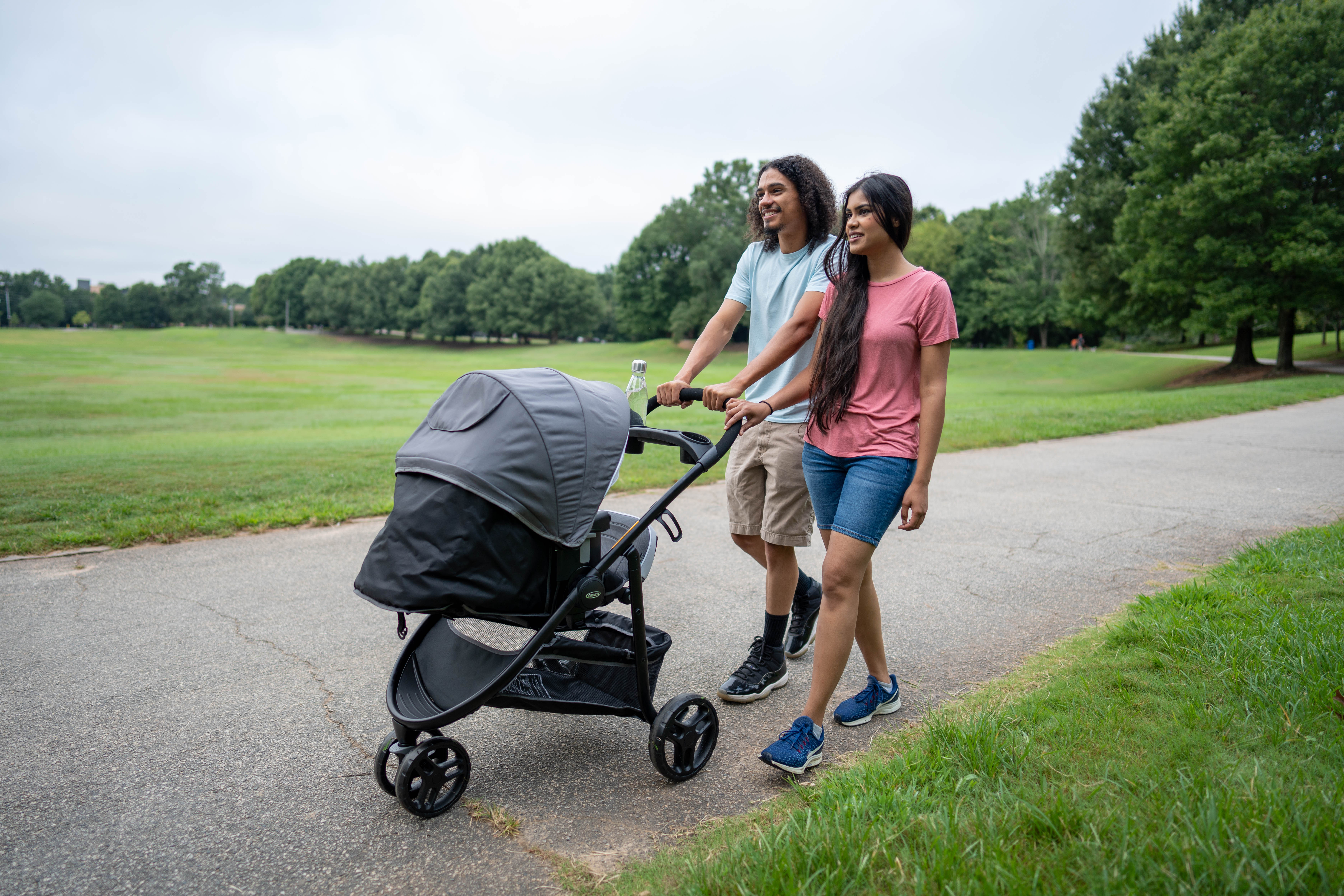 More Details about Couple Walking with Stroller