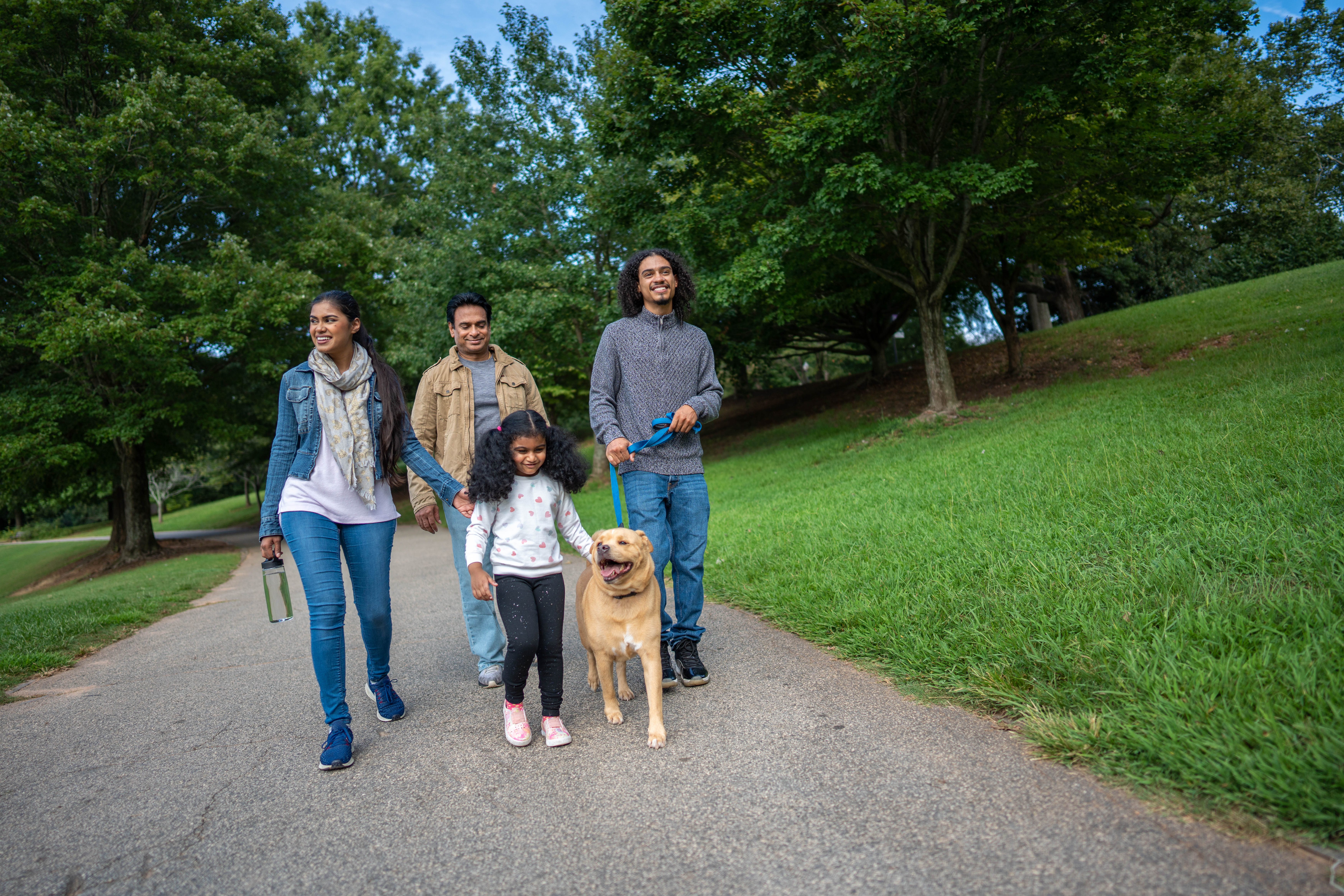 More Details about Family Walking with Dog